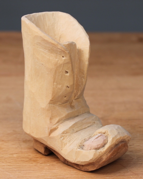 Woodcarving whittled boot